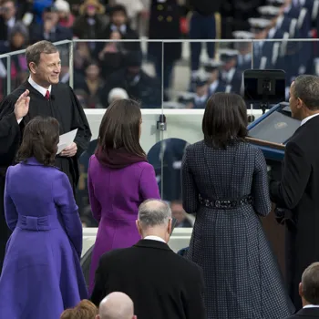 Chief Justice John G. Roberts Jr. administers the public oath of office to President Obama, as the president's wife and daughters watch.