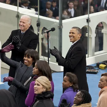 Vice President Biden, President Obama and family members acknowledge dignitaries behind the stage.