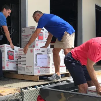 Federal defenders in Puerto Rico load generators onto a truck for transport to the Virgin Islands, which was hit by two hurricanes in a matter of weeks in 2017