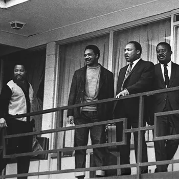 Shortly before he was slain on April 4, 1968, Martin Luther King, Jr., is flanked outside his motel room by Jesse Jackson and Ralph Abernathy. 