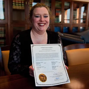 Miriam Vincent, a staff attorney for the National Archives and Records Administration, holds a certificate ascertaining South Dakota's 2012 electors.