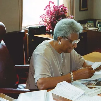 In her later years, Judge Constance Baker Motley works at her desk.