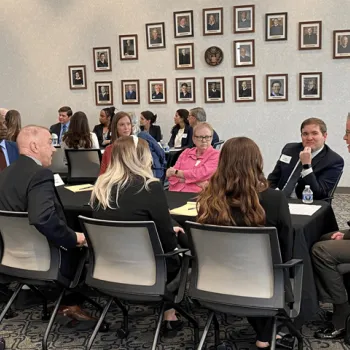 Attorneys and law students speak with federal judges during the Kansas City roundtable session.