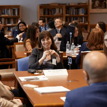 Participants share their interests in the law with District Judge Nina R. Morrison during the New York City roundtable session.