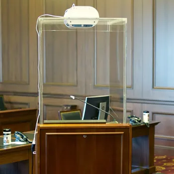 An enclosed lectern for lawyers is equipped with an air filter in the Southern District of New York.