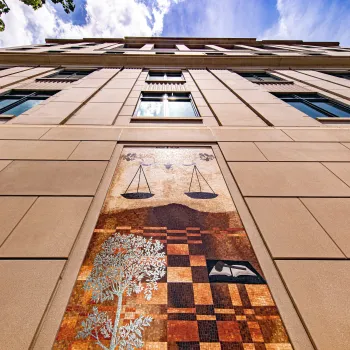 One of seven mosaics by artist Ellen Driscoll features the scales of justice on the outside walls of the new annex.