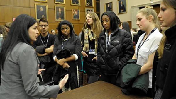 Attorney with students in courtroom