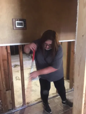 Court employee cleaning up a colleague's house.