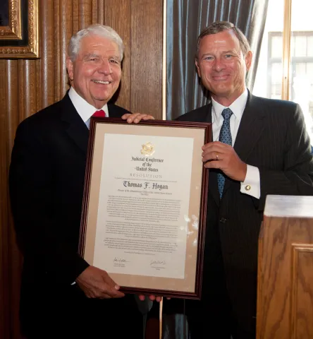 Judge Thomas F. Hogan Receives the Judicial Conference resolution from Chief Justice John Roberts Jr.