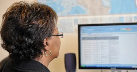 Image of woman reading computer screen