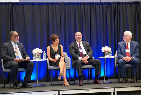 Panelists speak during a diversity symposium for law students and lawyers.