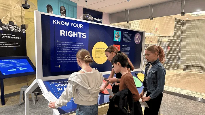 Students interact with exhibits at the new learning center in St. Paul, Minnesota.