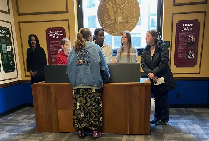 Visitors view exhibits at the new learning center at the federal courthouse in Indianapolis.