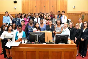 Students and program volunteers following a mock bankruptcy hearing in Boston.